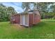 Brick home with rear entrance and well-maintained yard at 1154 Stringfellow Rd, Chester, SC 29706
