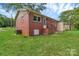Brick home's rear showcasing its well-maintained exterior and backyard at 1154 Stringfellow Rd, Chester, SC 29706