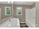 Bright bathroom featuring a white sink, neutral walls, and two windows at 1154 Stringfellow Rd, Chester, SC 29706