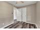 Bedroom with wood-look flooring, neutral walls, and closet doors at 1154 Stringfellow Rd, Chester, SC 29706