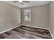 A cozy bedroom with new wood-look floors, ceiling fan, and neutral paint at 1154 Stringfellow Rd, Chester, SC 29706