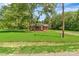 Quaint brick home with a sprawling front yard, complemented by mature trees at 1154 Stringfellow Rd, Chester, SC 29706