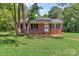 Charming brick home featuring a well-maintained lawn and a welcoming front porch at 1154 Stringfellow Rd, Chester, SC 29706