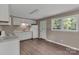 Bright kitchen featuring white cabinets, a stainless sink, and ample counter space at 1154 Stringfellow Rd, Chester, SC 29706