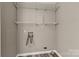 Laundry room with shelving and connections for a washer and dryer at 1154 Stringfellow Rd, Chester, SC 29706