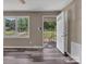 Living room featuring wood-look flooring, neutral paint, and lots of natural light at 1154 Stringfellow Rd, Chester, SC 29706