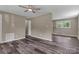 Open-concept living room featuring wood-look flooring, neutral walls, and natural light at 1154 Stringfellow Rd, Chester, SC 29706