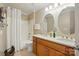 Bathroom featuring a dual sink vanity, and a shower with a white shower curtain at 129 Willow Tree Ln, Mount Holly, NC 28120
