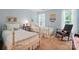Charming bedroom with twin beds, whimsical decor, and ample natural light from the large windows at 129 Willow Tree Ln, Mount Holly, NC 28120