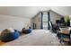 Bright bedroom with natural light, featuring two cozy beanbag chairs and a functional work-from-home setup at 129 Willow Tree Ln, Mount Holly, NC 28120