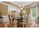 Warm dining room with a neutral color scheme, decorative rug, and chandelier at 129 Willow Tree Ln, Mount Holly, NC 28120
