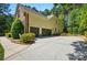 Spacious three-car garage with a long driveway offers ample parking at 129 Willow Tree Ln, Mount Holly, NC 28120