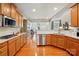 Spacious kitchen featuring stainless steel appliances, granite countertops, and wood floors at 129 Willow Tree Ln, Mount Holly, NC 28120