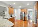Bright kitchen featuring stainless steel appliances, granite countertops, and hardwood floors at 129 Willow Tree Ln, Mount Holly, NC 28120