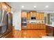 Bright kitchen features stainless steel appliances, granite countertops, and ample cabinet space at 129 Willow Tree Ln, Mount Holly, NC 28120