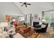 Bright living room featuring a fireplace, ample seating, and open access to adjacent rooms at 129 Willow Tree Ln, Mount Holly, NC 28120