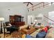 Large living room featuring high ceilings, a fireplace, and comfortable furnishings at 129 Willow Tree Ln, Mount Holly, NC 28120