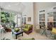 Cozy screened porch featuring comfortable seating, offering a relaxing space for enjoying the outdoors at 129 Willow Tree Ln, Mount Holly, NC 28120