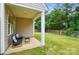 Serene backyard with covered patio area, perfect for outdoor relaxation and entertaining at 14402 Asheton Creek Dr, Charlotte, NC 28273
