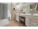 Bright bathroom featuring double vanity with make up station and tiled floors at 14402 Asheton Creek Dr, Charlotte, NC 28273