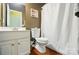 Cozy bathroom featuring a white vanity, toilet and shower with curtain at 14402 Asheton Creek Dr, Charlotte, NC 28273