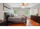 Charming bedroom with hardwood floors, two windows, and ceiling fan at 14402 Asheton Creek Dr, Charlotte, NC 28273
