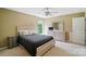 This bedroom features a neutral color palette and a large window, creating a calming and inviting atmosphere at 14402 Asheton Creek Dr, Charlotte, NC 28273