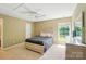 Bright bedroom featuring a ceiling fan, a neutral color palette, and a lovely window with a view of greenery at 14402 Asheton Creek Dr, Charlotte, NC 28273
