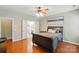 Comfortable bedroom with doorway leading to a bright bathroom with double vanity at 14402 Asheton Creek Dr, Charlotte, NC 28273