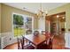 Bright dining room featuring a large window with a view of the outdoors and a decorative chandelier at 14402 Asheton Creek Dr, Charlotte, NC 28273