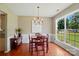 Dining room with a large window and hardwood floors at 14402 Asheton Creek Dr, Charlotte, NC 28273