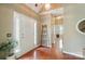Inviting foyer featuring hardwood floors and ample natural light at 14402 Asheton Creek Dr, Charlotte, NC 28273