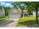Charming home featuring a well-maintained lawn and a two-car garage at 14402 Asheton Creek Dr, Charlotte, NC 28273