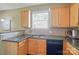 Granite countertops, tile backsplash, and ample cabinet space enhance this kitchen's functionality at 14402 Asheton Creek Dr, Charlotte, NC 28273
