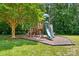 Community playground featuring a slide and climbing structure, perfect for entertainment at 14402 Asheton Creek Dr, Charlotte, NC 28273