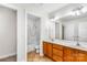 Bathroom with double sink vanity, neutral tile floors, updated fixtures, and a shower/tub combination at 14426 Harvington Dr, Huntersville, NC 28078