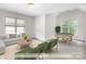 Bonus room with vaulted ceilings, lots of natural light, and billiard table at 14426 Harvington Dr, Huntersville, NC 28078