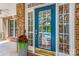 Inviting front door with glass panels, complemented by a stylish flower pot at 14426 Harvington Dr, Huntersville, NC 28078