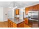 Large kitchen with granite countertops, central island, stainless steel appliances, and ample storage at 14426 Harvington Dr, Huntersville, NC 28078