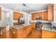 Spacious kitchen with granite countertops, stainless steel appliances, and wooden cabinets at 14426 Harvington Dr, Huntersville, NC 28078
