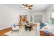 Comfortable living room with hardwood floors, white furniture, and lots of natural light at 14426 Harvington Dr, Huntersville, NC 28078