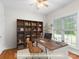 This office space includes a desk, shelving, and natural light at 14426 Harvington Dr, Huntersville, NC 28078