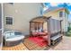 This outdoor deck area includes stylish seating, a pergola, and provides an ideal space for relaxation and entertainment at 14426 Harvington Dr, Huntersville, NC 28078