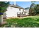 Grassy backyard with a spacious deck, perfect for entertaining and outdoor activities at 16028 Hallaton Dr, Huntersville, NC 28078