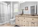 Bathroom with gray walls, granite vanity, shower with gray and white curtain, and neutral tile flooring at 16028 Hallaton Dr, Huntersville, NC 28078