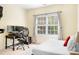 Bedroom with desk, bed, and view to the outside from the window at 16028 Hallaton Dr, Huntersville, NC 28078