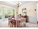 Bright dining room with chandelier, large window, and classic trim work at 16028 Hallaton Dr, Huntersville, NC 28078