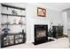 Inviting fireplace with black marble surround, decorative shelving and stylish decor at 16028 Hallaton Dr, Huntersville, NC 28078