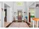 Elegant foyer with hardwood floors, a high ceiling, and ample natural light at 16028 Hallaton Dr, Huntersville, NC 28078