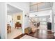 Open foyer with hardwood floors, staircase, and views into other living spaces at 16028 Hallaton Dr, Huntersville, NC 28078
